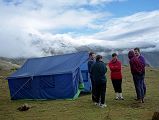 8 1 Outside Mess Tent At Dhampu After Theft As I drank my tea the next morning, I heard Shane cursing profusely. Those bastards, they stole my hiking boots, my Gore-Tex jacket, and even my Tibetan phrase book. She was fuming, and quite rightly so. I left them in the vestibule of my tent which was zipped up. I cant believe it. I cant believe it. Tashi walked over and Shane went through what was stolen. Kumar and Tashi then walked to the other tents to see if anything else was stolen. Gerhardt and Valerie werent so lucky; he lost his Gore-Tex jacket while she had her hiking boots stolen. Kumar walked back to Shane and Valerie and told them it probably was the local villagers, and that nothing could be done. He asked them if we needed to go back to Kharta to try and find new shoes, but luckily both Shane and Valerie had running shoes.